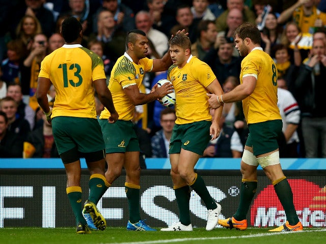 Kurtley Beale of Australia congratulates Drew Mitchell after he scored his teams second try during the 2015 Rugby World Cup Quarter Final match between Australia and Scotland at Twickenham Stadium on October 18, 2015 in London, United Kingdom.