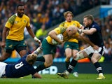 Stephen Moore of Australia is tackled by David Denton (L) and Finn Russell of Scotland during the 2015 Rugby World Cup Quarter Final match between Australia and Scotland at Twickenham Stadium on October 18, 2015 in London, United Kingdom.
