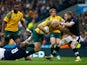 Stephen Moore of Australia is tackled by David Denton (L) and Finn Russell of Scotland during the 2015 Rugby World Cup Quarter Final match between Australia and Scotland at Twickenham Stadium on October 18, 2015 in London, United Kingdom.
