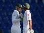 Shoaib Malik is congratulated by Younis Khan after reaching his 100 on day one of the first Test against England in Abu Dhabi on October 13, 2015