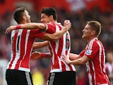 Jose Fonte (C) of Southampton celebrates scoring his team's first goal with his team mates Dusan Tadic (L) and Steven Davis (R) during the Barclays Premier League match between Southampton and Leicester City at St Mary's Stadium on October 17, 2015