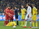Spain's players argue with the referee during the Euro 2016 qualifying football match between Ukraine and Spain at Olympiysky stadium in Kiev on October 12, 2015