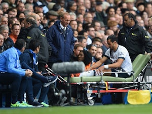 Nacer Chadli of Tottenham Hotspur is taken off by a stretcher after injury during the Barclays Premier League match between Tottenham Hotspur and Liverpool at White Hart Lane on October 17, 2015