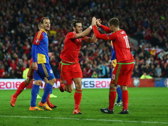 Gareth Bale of Wales celebrates with Aaron Ramsey (R) as he scores their second goal during the UEFA EURO 2016 qualifying Group B match between Wales and Andorra at Cardiff City Stadium on October 13, 2015