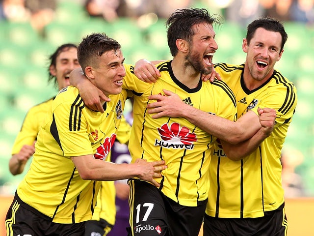 Vince Lia of the Phoenix celebrates with Louis Fenton and Blake Powell of the Phoenix after scoring a goal during the round two A-League match between the Perth Glory and Wellington Phoenix at nib Stadium on October 18, 2015