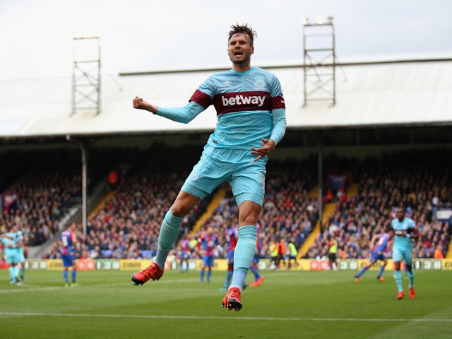 Carl Jenkinson of West Ham United celebrates scoring his team's first goal during the Barclays Premier League match between Crystal Palace and West Ham United at Selhurst Park on October 17, 2015
