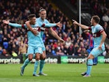 Manuel Lanzini (L) of West Ham United celebrates scoring his team's second goal with his team mates Andy Carroll (C) and Aaron Cresswell (R) during the Barclays Premier League match between Crystal Palace and West Ham United at Selhurst Park on October 17