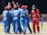 Afghan players celebrate next to Zimbabwe's Chamunorwa Chibhabha (R) during the final game in a series of five ODI cricket matches between Afghanistan and hosts Zimbabwe at Queens Sports Club, in Bulawyo, on October 24, 2015.