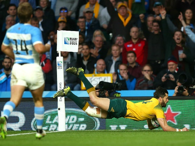 Adam Ashley-Cooper of Australia dives over to score his sides third try during the 2015 Rugby World Cup Semi Final match between Argentina and Australia at Twickenham Stadium on October 25, 2015 in London, United Kingdom.