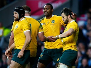 Adam Ashley-Cooper (r) celebrates with Tevita Kuridrani of Australia (2nd r) celebrates scoring his sides third try during the 2015 Rugby World Cup Semi Final match between Argentina and Australia at Twickenham Stadium on October 25, 2015 in London, Unite