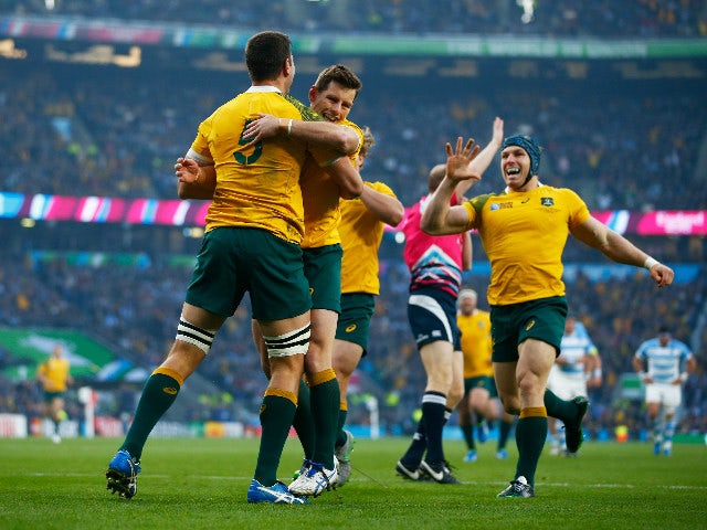 Rob Simmons (l) celebrates with Bernard Foley of Australia after scoring the opening try during the 2015 Rugby World Cup Semi Final match between Argentina and Australia at Twickenham Stadium on October 25, 2015 in London, United Kingdom.