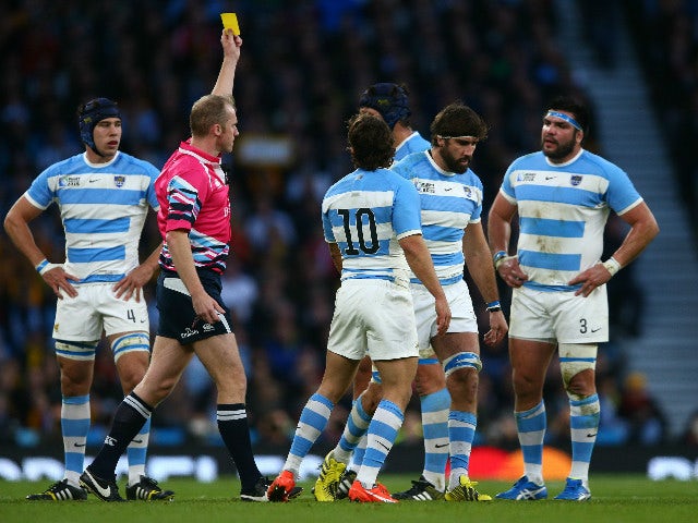Tomas Lavanini of Argentina shown a yellow card and sent to sin bin by referee Wayne Barnes of England during the 2015 Rugby World Cup Semi Final match between Argentina and Australia at Twickenham Stadium on October 25, 2015 in London, United Kingdom.