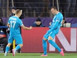 Zenit's Russian forward Artem Dzyuba (R) celebrates after scoring a goal during the UEFA Champions League group H football match between FC Zenit and Olympique Lyonnais at the Petrovsky stadium in St. Petersburg on October 20, 2015.