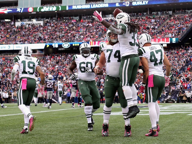 Chris Ivory #33 of the New York Jets reacts after scoring a touchdown during the third quarter against the New England Patriots at Gillette Stadium on October 25, 2015