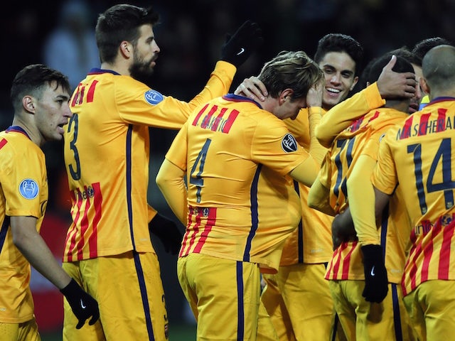 Barcelona's players celebrate a goal during the UEFA Champions League group E football match between FC BATE Borisov and FC Barcelona at the Borisov Arena stadium outside Minsk on October 20, 2015.