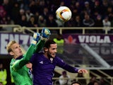 KKS Lech Poznan's goalkeeper of Bosnia Jasmin Buric (L) deflects the ball in front of Fiorentina's midfielder from Spain Mario Suarez during the UEFA Europa League group I football match Fiorentina vs Lech Poznan at the 'Artemio Franchi' stadium on Octobe