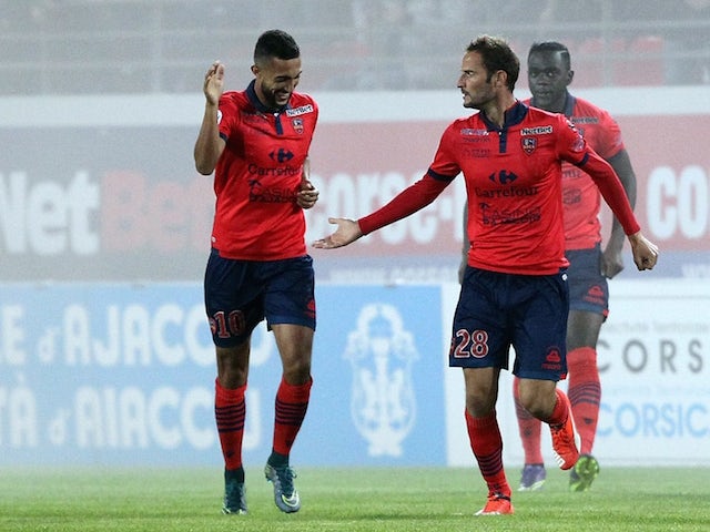 Ajaccio's French forward Gregory Pujol (2ndR) is congratulated by teammates after scoring a goal during the French L1 football match between Gazelec Ajaccio (GFCA) and Nice (OGCN) on October 24, 2015, at the Ange Casanova stadium in Ajaccio, on the French