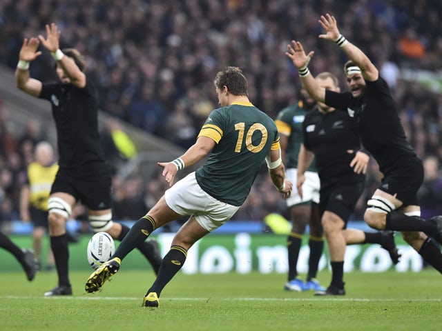 South Africa's fly half Handre Pollard (C) kicks the ball during a semi-final match of the 2015 Rugby World Cup between South Africa and New Zealand at Twickenham Stadium, southwest London, on October 24, 2015