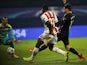 Olympiakos' Nigerian player Ideye Brown (C) shoots to score during the UEFA Champions League football match between Dinamo Zabreb and Olympiakos at the Stadion Maksimir stadium in Zagreb on October 20, 2015.