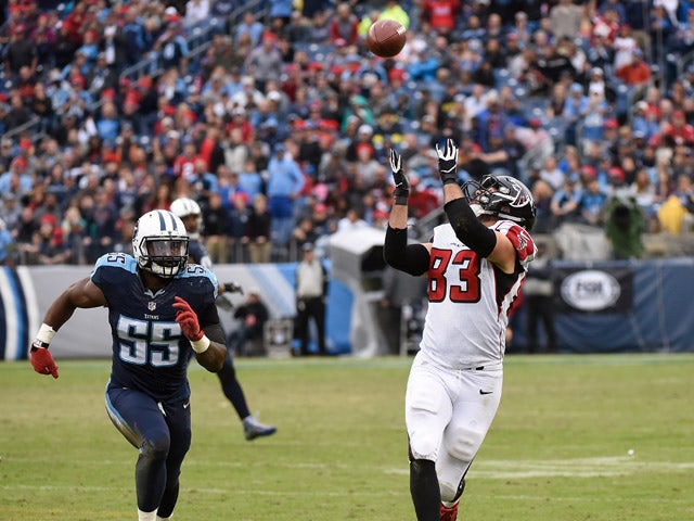 Zach Brown #55 of the Tennessee Titans chases Jacob Tamme #83 of the Atlanta Falcons as he makes an over the shoulder catch during the second half at Nissan Stadium on October 25, 2015