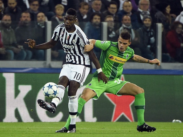 Juventus' midfielder from France Paul Pogba (L) vies with Moenchengladbach's Swiss midfielder Granit Xhaka during the UEFA Champions League football match Juventus vs Borussia Monchengladbach on October 21, 2015 at the Juventus stadium in Turin.