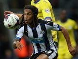 Kevin Mbabu of Newcastle vies with Atdhe Nuhiu of Sheffield Wednesday during the Capital One Cup Third Round match between Newcastle United and Sheffield Wednesday at St James Park on September 23, 2015