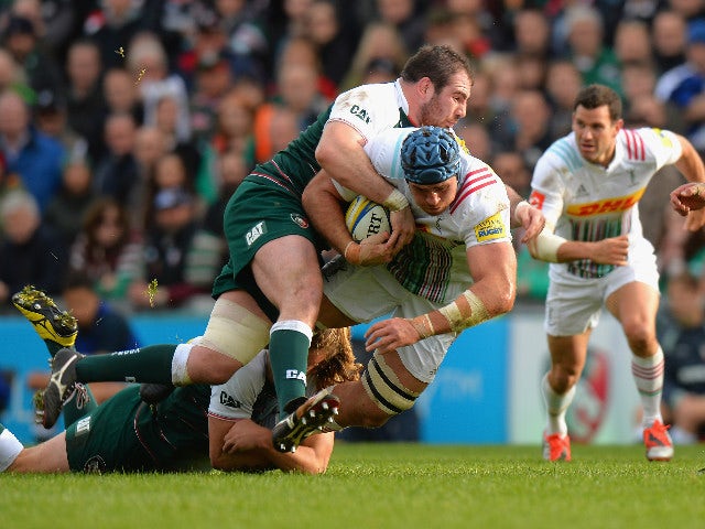 Sam Harrison and Fraser Balmain of Leicester Tigers tackle James Horwill of Harlequins during the Aviva Premiership match between Leicester Tigers and Harlequins at Welford Road on October 25, 2015 in Leicester, England.