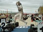 Mercedes AMG Petronas driver Lewis Hamilton of Britain leaps from his car as he celebrates winning the United States Formula One Grand Prix at the Circuit of The Americas in Austin, Texas on October 25, 2015