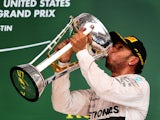 Lewis Hamilton of Great Britain and Mercedes GP celebrates after winning the United States Formula One Grand Prix and the championship at Circuit of The Americas on October 25, 2015