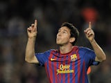Barcelona's Argentinian forward Lionel Messi celebrates after scoring a goal during their Spanish League football match between FC Barcelona and Mallorca FC on October 29, 2011
