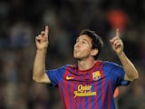Barcelona's Argentinian forward Lionel Messi celebrates after scoring a goal during their Spanish League football match between FC Barcelona and Mallorca FC on October 29, 2011