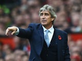 Manuel Pellegrini, manager of Manchester City gestures during the Barclays Premier League match between Manchester United and Manchester City at Old Trafford on October 25, 2015 in Manchester, England.