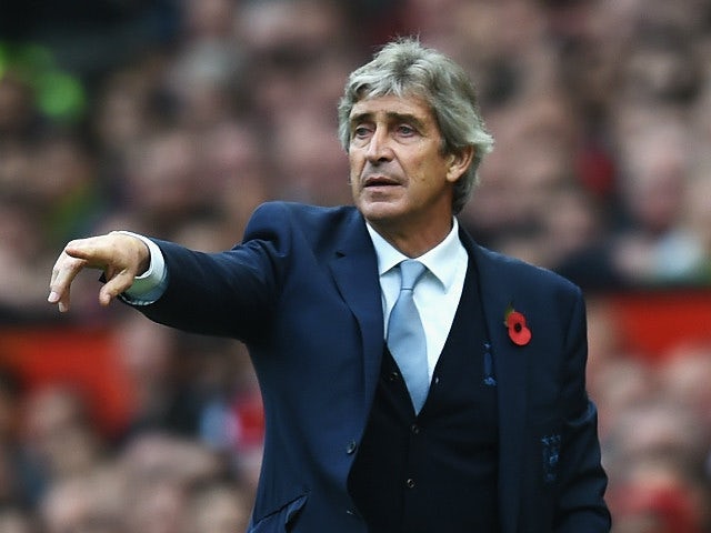 Manuel Pellegrini, manager of Manchester City gestures during the Barclays Premier League match between Manchester United and Manchester City at Old Trafford on October 25, 2015 in Manchester, England.