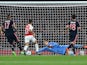 Bayern Munich's goalkeeper Manuel Neuer dives to save a shot from Arsenal's German midfielder Mesut Ozil (unseen) during the UEFA Champions League football match between Arsenal and Bayern Munich at the Emirates Stadium in London, on October 20, 2015.