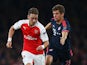 Mesut Oezil of Arsenal is chased by Thomas Mueller of Bayern Munich during the UEFA Champions League Group F match between Arsenal FC and FC Bayern Munchen at Emirates Stadium on October 20, 2015 in London, United Kingdom.