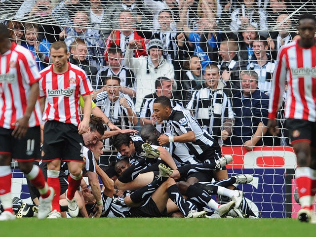 Newcastle players celebrate the first goal by Kevin Nolan during the Barclays Premier League match between Newcastle United and Sunderland at St James' Park on October 31, 2010