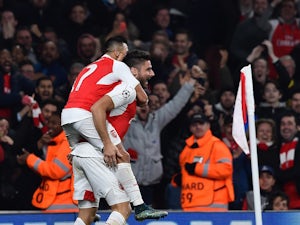 Arsenal's French striker Olivier Giroud (R) celebrates scoring his team's first goal with Arsenal's Chilean striker Alexis Sanchez during the UEFA Champions League football match between Arsenal and Bayern Munich at the Emirates Stadium in London, on Octo