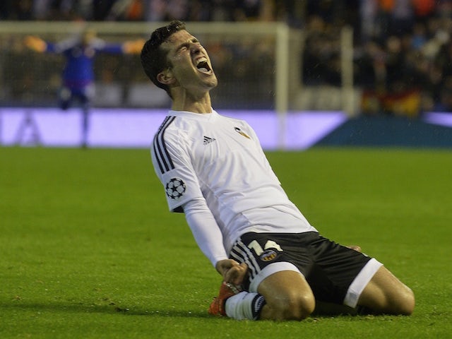 Valencia's Argentinian forward Pablo Piatti celebrates after scoring during the UEFA Champions League group H football match Valencia CF vs KAA Gent at the Mestalla stadium in Valencia on October 20, 2015.