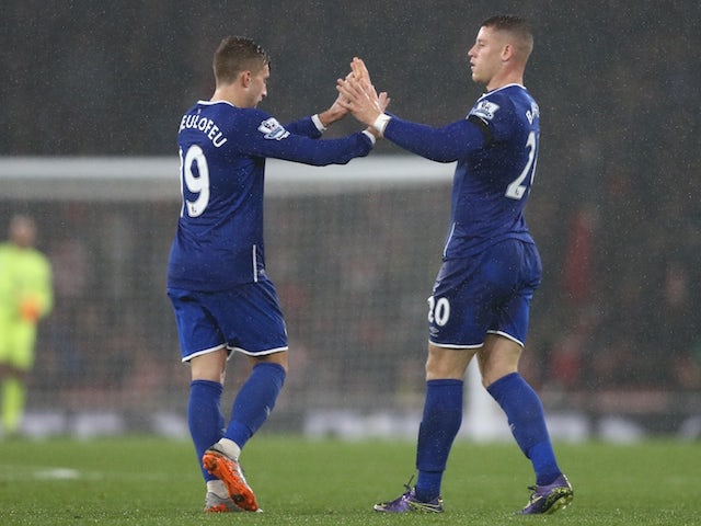 Everton's English midfielder Ross Barkley (R) celebrates with Everton's Spanish midfielder Gerard Deulofeu after he scores their first goal with a deflected shot during the English Premier League football match between Arsenal and Everton at the Emirates 