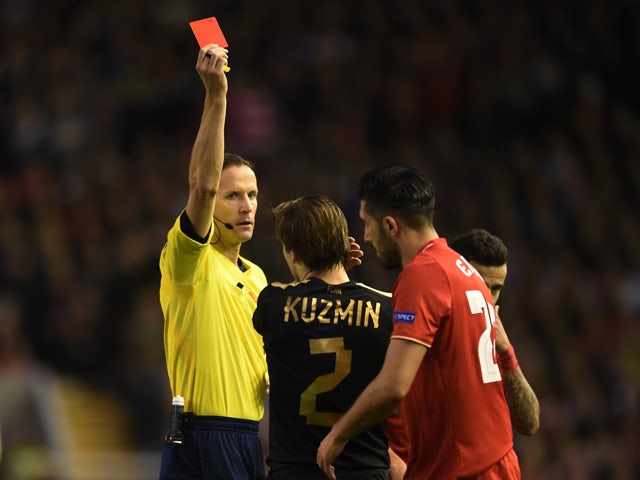 Oleg Kuzmin of Rubin Kazan is sent off by referee Robert Schorgenhofer of Austria after his second bookable offence during the UEFA Europa League Group B match between Liverpool FC and Rubin Kazan at Anfield on October 22, 2015