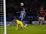 Sam Baldock of Brighton chips goalkeeper Frank Fielding of Bristol City only to see his shot cleared off the line during the Sky Bet Championship match between Brighton & Hove Albion and Bristol City at Amex Stadium on October 20, 2015 in Brighton, Englan