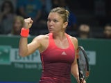Simona Halep of Romania celebrates winning a point against Falvia Pennetta of Italy during their season-ending tennis WTA Final in Singapore on October 25, 2015