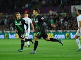 Bojan Krkic of Stoke City celebrates with Xherdan Shaqiri (22) as he scores their first goal from the penalty spot during the Barclays Premier League match between Swansea City and Stoke City at Liberty Stadium on October 19, 2015