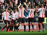 Sunderland players celebrate their team's second goal by Billy Jones (obscured) during the Barclays Premier League match between Sunderland and Newcastle United at Stadium of Light on October 25, 2015 in Sunderland, England.