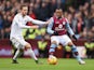 Jordan Ayew of Aston Villa and Gylfi Sigurdsson of Swansea City compete for the ball during the Barclays Premier League match between Aston Villa and Swansea City at Villa Park on October 24, 2015