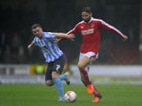 Jordan Turnbull of Swindon Town is tackled by John Fleck of Coventry City during the Sky Bet League One match between Swindon Town and Coventry City at The County Ground on October 24, 2015