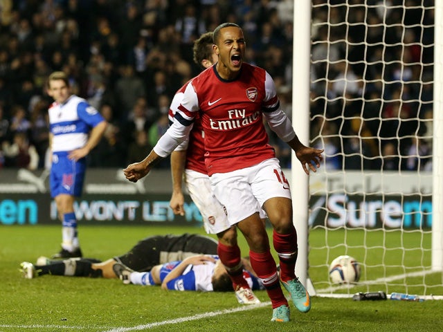 Theo Walcott of Arsenal celebrates their sixth goal during the Capital One Cup Fourth Round match between Reading and Arsenal at Madejski Stadium on October 30, 2012