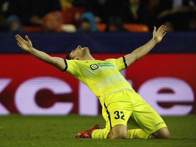 Gent's midfielder Thomas Foket celebrates after scoring during the UEFA Champions League group H football match Valencia CF vs KAA Gent at the Mestalla stadium in Valencia on October 20, 2015.