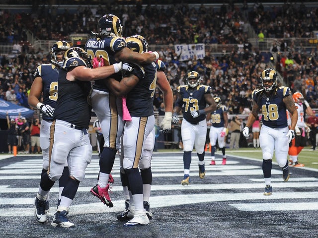 Todd Gurley celebrates with teammates after scoring a touchdown against the Cleveland Browns in the third quarter at the Edward Jones Dome on October 25, 2015