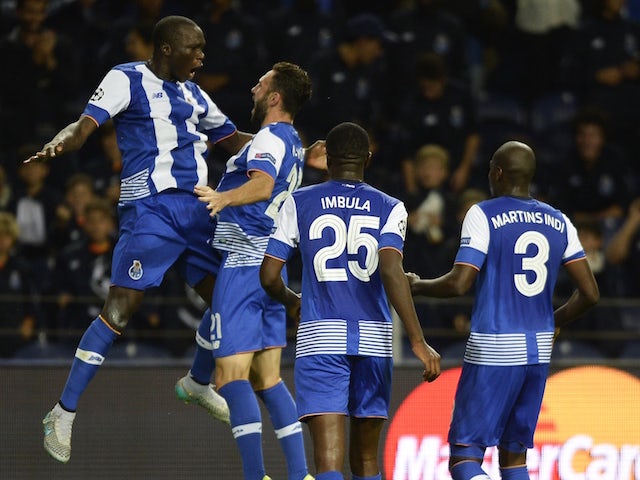 Porto's Cameroonian forward Vincent Aboubakar (L) celebrates with teammates after scoring a goal during the UEFA Champions League group G football match FC Porto vs Maccabi Tel-Aviv FC at the Dragao stadium in Porto on October 20, 2015. 